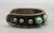 5 green turquoise stones, darkened silver background, silver dots