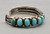 15 natural turquoise stones, darkened silver background, three wire terminal,