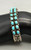 hefty two row turquoise bracelet,  deep stamping, darkened silver background, smooth silver cuff