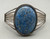 central denim lapis cabochon, seven wire terminal, Cecil Henry