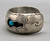 three turquoise cabochons, shadowbox cutouts, darkened silver, smooth silver cuff