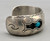 three turquoise cabochons, shadowbox cutouts, darkened silver, smooth silver cuff