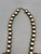Circa 1920s to 1930s, 2 wire naja, four petal blossoms,