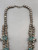 needlepoint turquoise, four petal blossoms, handmade silver beads, circa 1940s