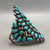 natural turquoise, cluster, darkened silver background, three wire terminal, circa 1950s