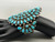 natural turquoise, cluster, darkened silver background, three wire terminal, circa 1950s