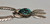 Circa 1980s, large pendant with turquoise stone, dangling leaves,