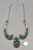 bib style design, natural turquoise, darkened background, handmade silver link chain, Martha Willeto
