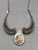 bib style design, natural turquoise, darkened background, handmade silver link chain, Martha Willeto