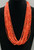 21 strand, coral and gold beads, black Pueblo wrap,