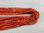 21 strand, coral and gold beads, black Pueblo wrap,