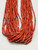 21 strand, coral and gold beads, black Pueblo wrap,