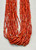 21 strand, coral and gold beads, black Pueblo wrap,