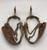 fancy California style spurs, leather spur straps, single mounted, iron work, 14 point rowels, turned down shanks, chap guards, engraved silver buttons, incised silver, original heel chains,