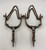 fancy California Style spurs, single mounted, nice iron work, 10 point rowels, turned down shanks, chap gueards, button with floral decoration, inlaid silver, original heel chains, stamped 8157