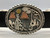storyteller, eight conchos, silver and bronze overlay, etched technique, textured and darkened background, black leather belt, Calvin Peterson,