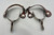Ray Anderson, swan neck spurs,, engraved silver appliques, diamond shape incised silver plates, silver heel buttons, basket weave pattern.