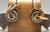 Spanish Style, drop shanks, silver mountings, single mounted, silver engraved concho style button, stamped designs,twisted rope edging, 16 point rowels, Circa early 1900s