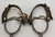 California style spurs, silver mountings, leather straps, single mounted spurs, engraved silver, inlaid silver strips, 10 point rowel,  Circa early 1900s