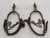 California style spurs, silver mountings, leather straps, single mounted spurs, engraved silver, inlaid silver strips, 10 point rowel,  Circa early 1900s