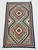 Finely woven, busy pattern, Navajo textile, muted palette, serrated edges, Native American, vintage