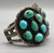 1960s, natural turquoise, cluster, darkened silver backgrounds, twisted wire, decorative edges, silver flowers three wire terminal, Navajo