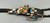 Zuni-made bolo tie with Buffalo Dancer design from 1930s to 1970s