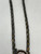Zuni-made bolo tie with Buffalo Dancer design from 1930s to 1970s