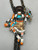 Zuni-made bolo tie with Buffalo Dancer design from 1930s to 1970s