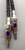 Beautiful hand-braided leather cord with two sterling silver slides, coral and lapis inlay and hand-embellished designs. Custom bolo tips also feature coral and lapis inlay. Made by Alvin Begay Navajo