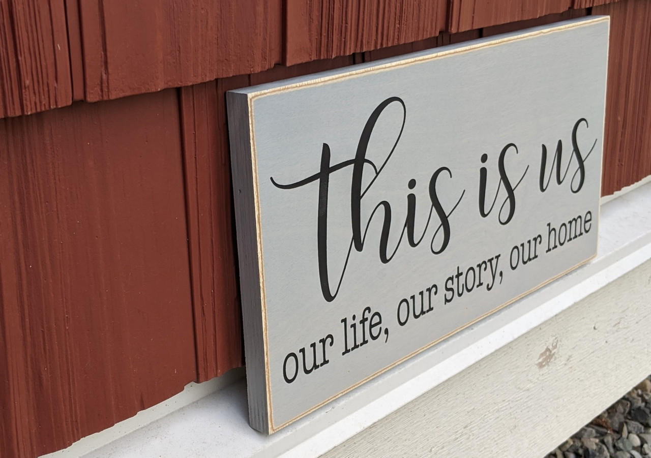 Side view of This is us - our life, our story, our home - sign