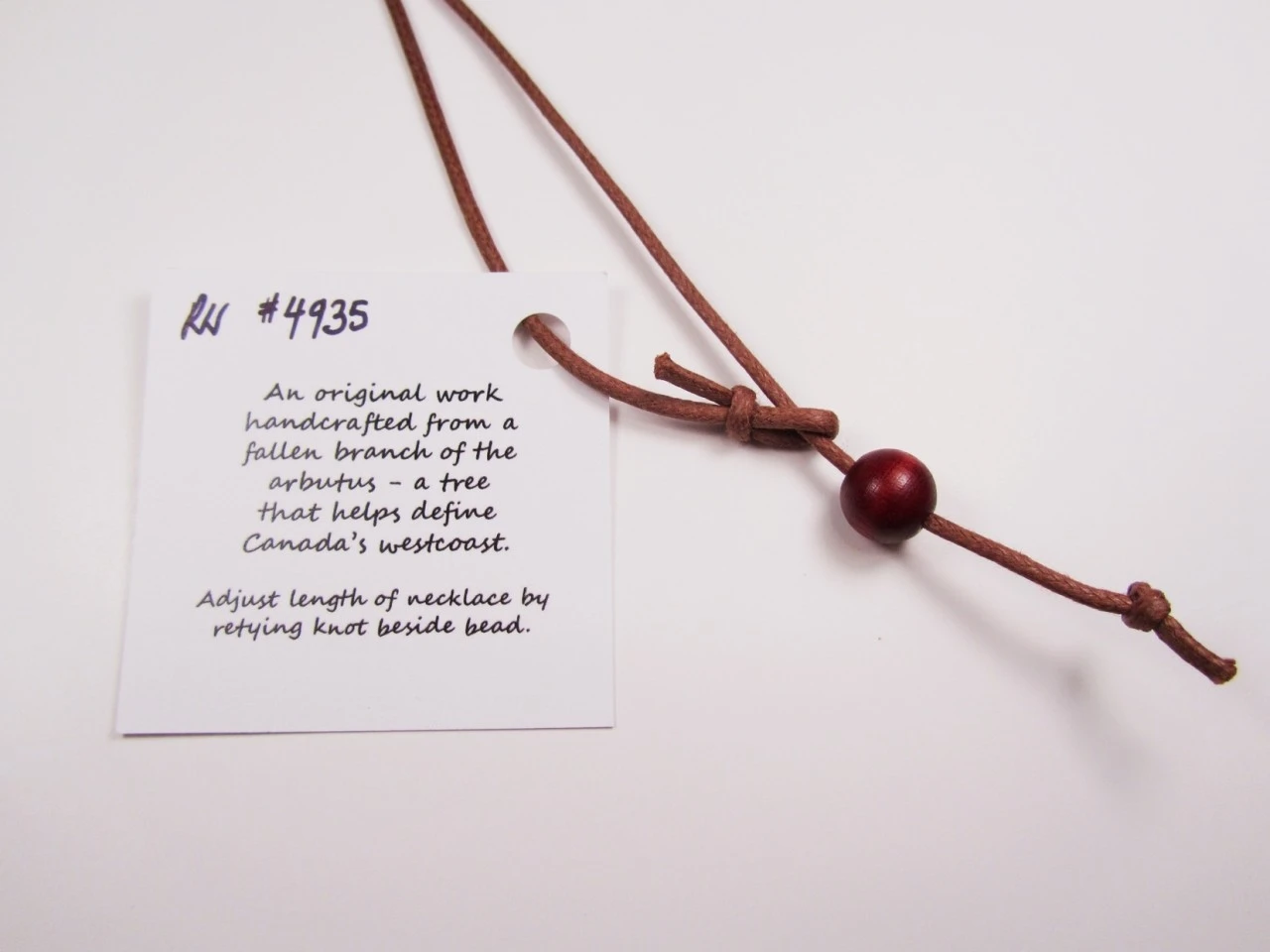 Necklace wood bead. Try also replacing with your own silver chain. It will look beautiful!