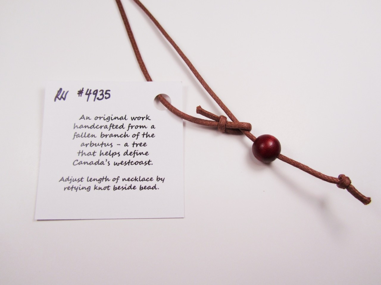 Necklace wood bead. Try also replacing with your own silver chain. It will look beautiful!