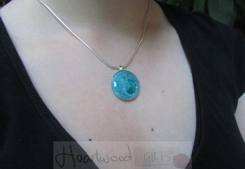 Model with Momo Glassworks Aqua Glass Medallion