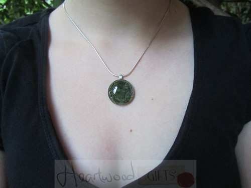 Model with Momo Glassworks Olive Glass Medallion