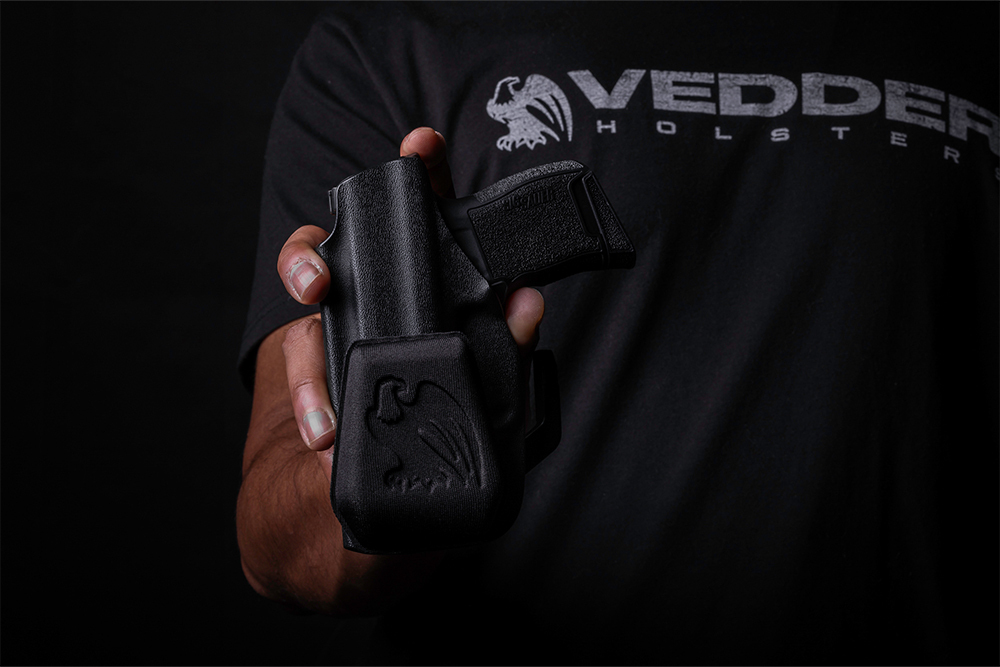 Vedder's holster Wedge attached to a LightTuck - The wedge is a small device that attaches to an IWB holster to reduce printing.