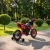 Red 12v Ride on 7UP Motorbike with removable training wheels