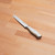 Henckels Forged Accent 5-inch Serrated Utility Knife - White Handle