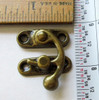 Swing arm latch antique brass