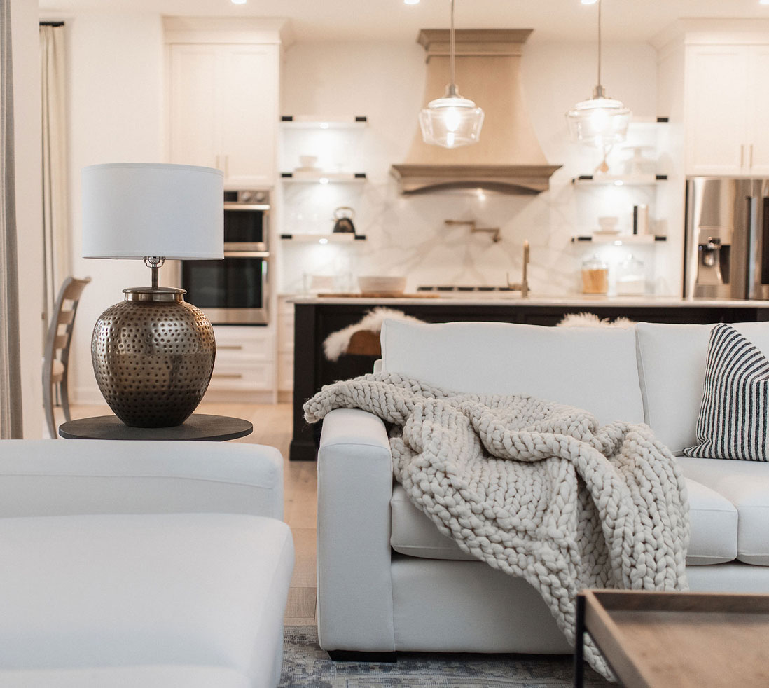 family room with drop down ceiling lights overlooking kitchen