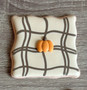 cute pillow cookie with pumpkin design