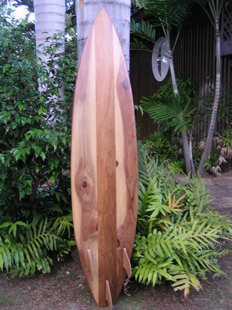 Carved wooden shortboard