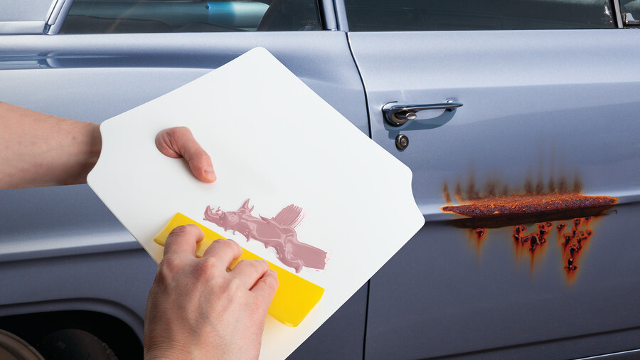 Performance Tool body repair tools, featuring a plastic spreader with body filler.