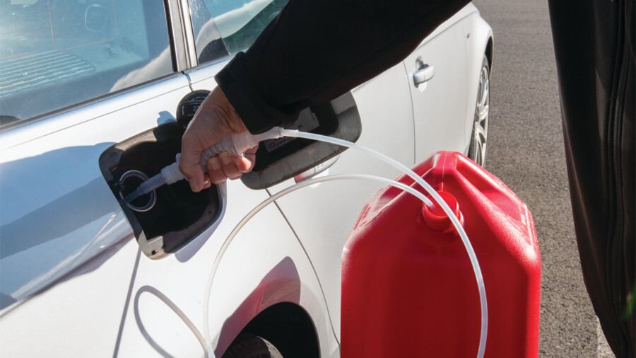 Performance Tool Fluid Transfer Pumps and Tools. Featuring an image of a siphon pump being used to transfer fuel into a vehicles fuel tank.