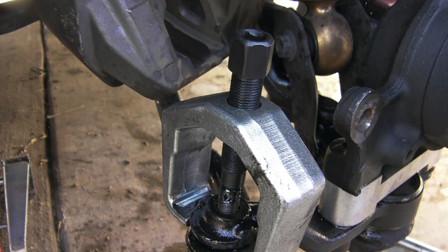 Performance Tool Tie Rod/Pitman Tools. Featuring an image of a pitman arm puller in use. 