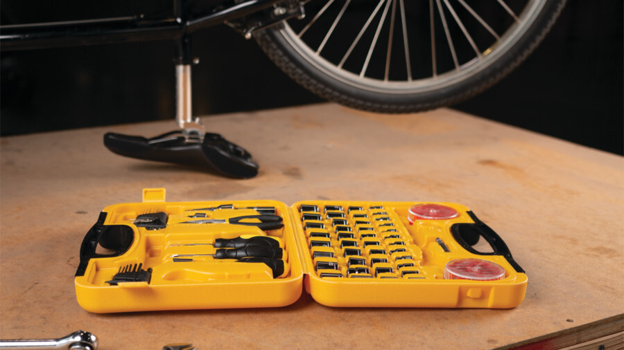 Performance Tool tool sets featuring an image of a garage toolset being used on a bike