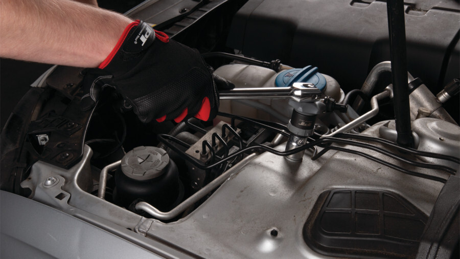 Performance Tool ratchets featuring an image of a breaker bar attached to a ratcheting socket being used on a nut