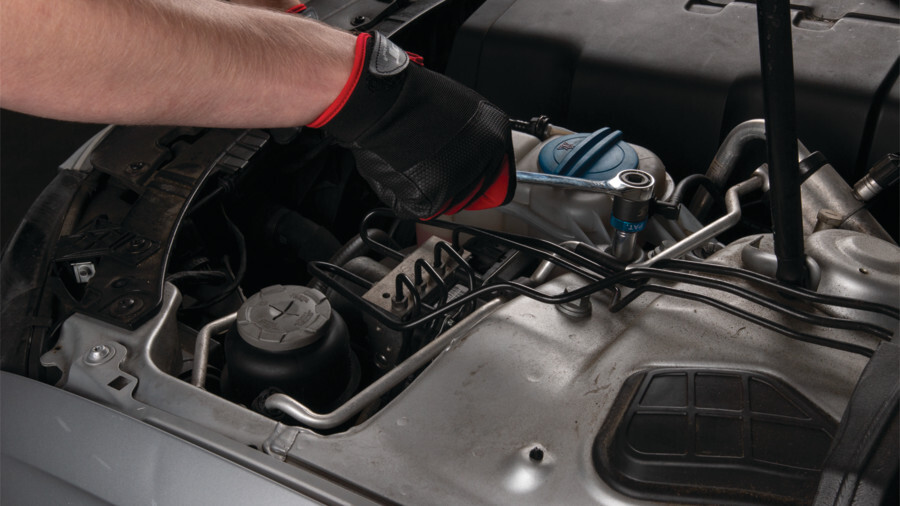 Performance Tool socket adapters and u-joints, featuring an image of a 1/2-inch Dr. Ratcheting Adapter being used under the hood