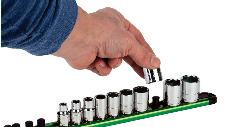 Performance Tool socket holders featuring a green socket holder with a hand approaching it