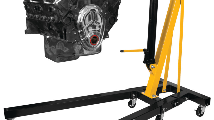 Performance Tool engine support equipment. Featuring an image of an engine hanging from an engine crane.